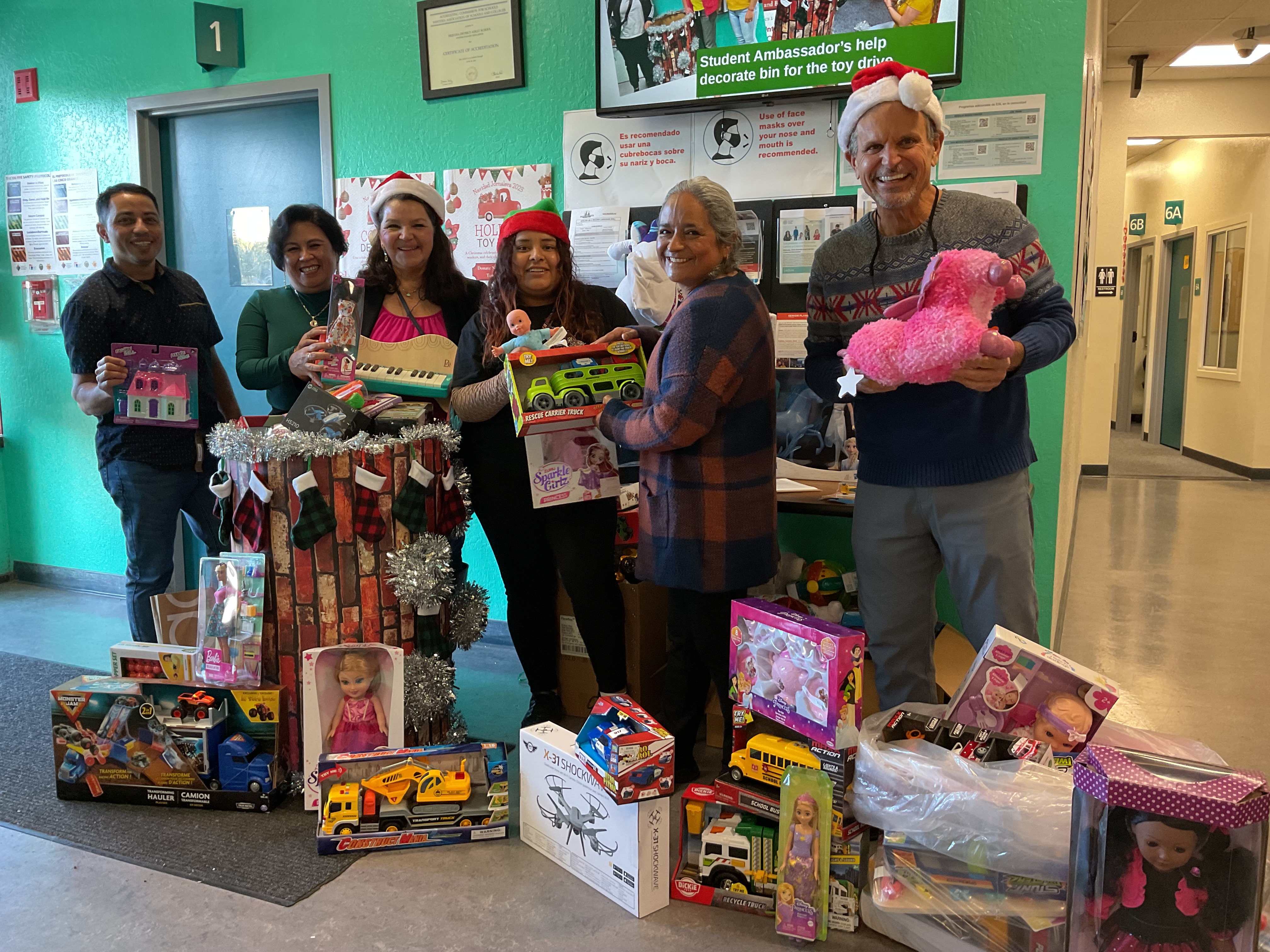 students with toys collected for 2023 toy drive